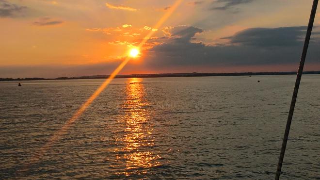 View of sunset from boat on Tall Ships 2018 trip